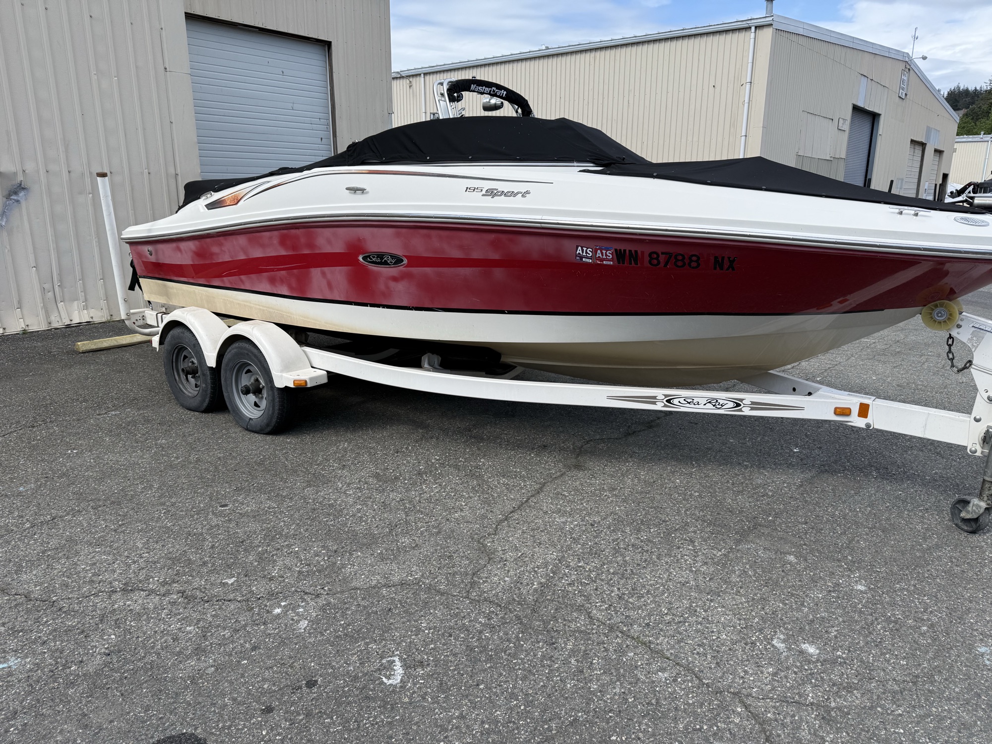 Same Sea Ray before detailing, dull and faded gelcoat